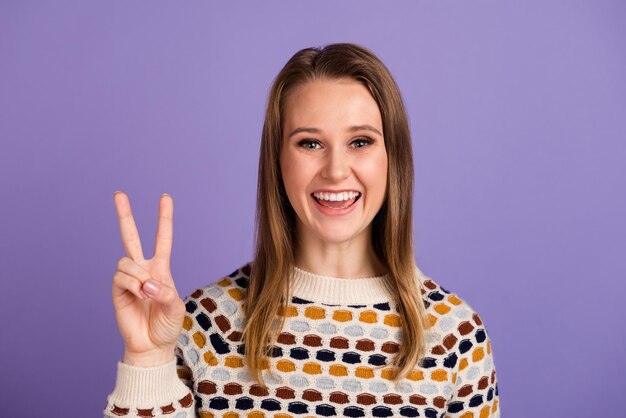 Photo of amazing lady showing vsign symbols saying hello isolated purple color background