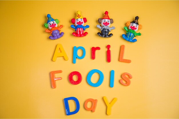 Photo of april fools day on yellow background with