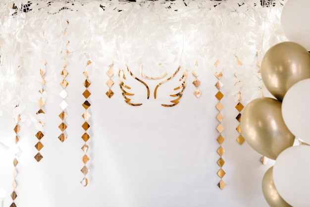 Photo area in golden style Arch with angel wings for a party Baby shower party newborn baby party birthday party concept design decorations