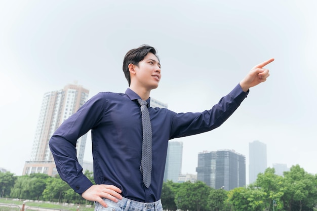Photo of Asian businessman outdoors