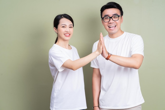 Photo of Asian couple on background