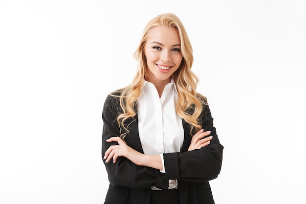 Photo of attractive businesswoman wearing office suit standing with arms crossed, isolated