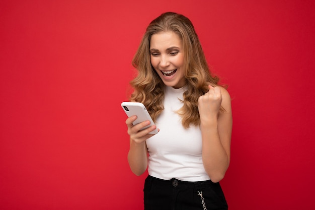 Photo of attractive crazy amazed surprised young woman wearing casual stylish clothes standing