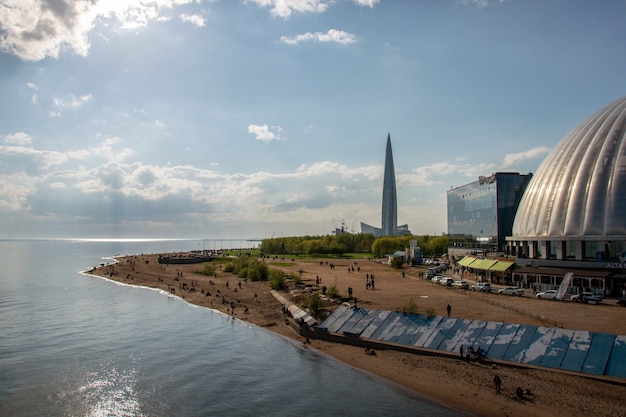 Photo of beach and the embankment of the Neva Bay 