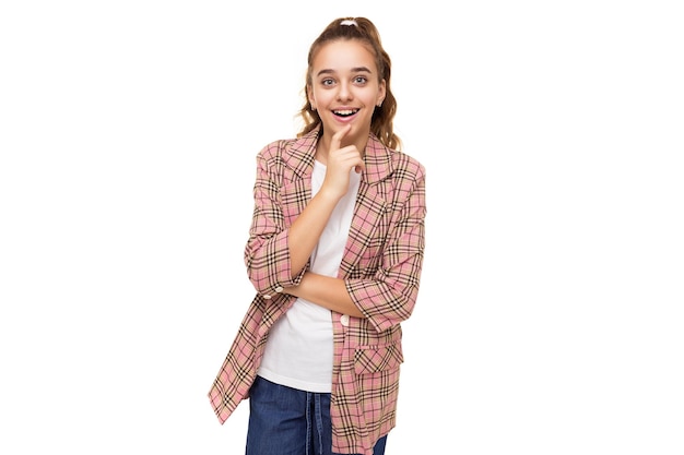 Photo of beautiful amazing happy shocked surprised brunette teenage girl with ponytail in stylish