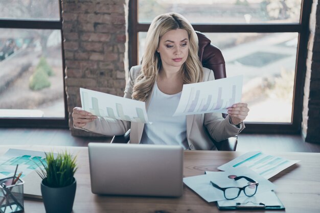 Photo of beautiful business lady read documents graphs