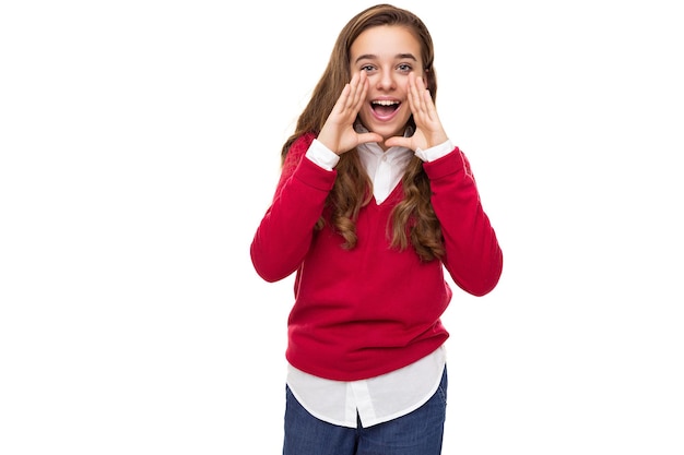 Photo of beautiful cute charming positive brunette teenage girl with long hair in stylish red