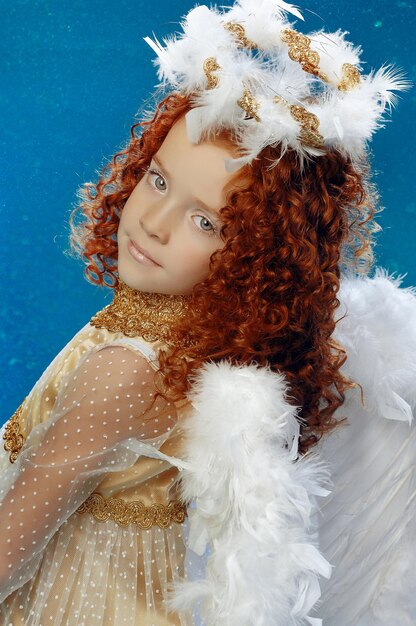 Photo of a beautiful little girl dressed in angel costume