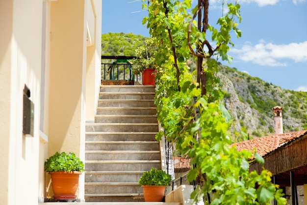 photo of beautiful stairs of one of buildings in sunny Greece