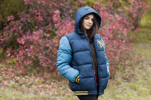 photo of a beautiful young brunette girl in the park