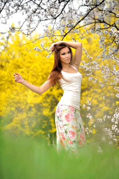 Photo of beautiful young girl in the beautiful countryside in bright colors