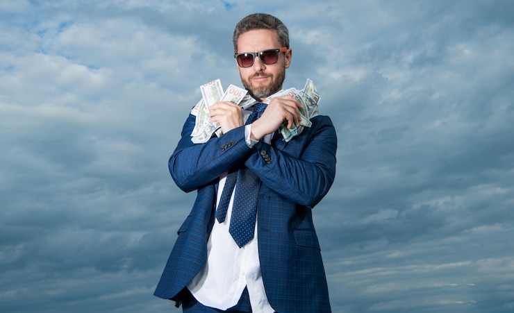 Photo photo of billionaire man show money billionaire man with money on sky background