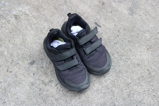 Photo of black shoes worn on the street