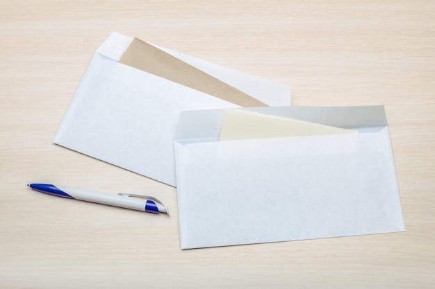 Photo of blank envelope on a wood