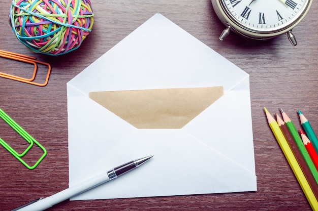 Photo of blank envelope on a  wooden background