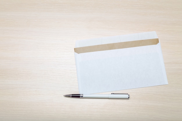 Photo of blank envelope on a  wooden background