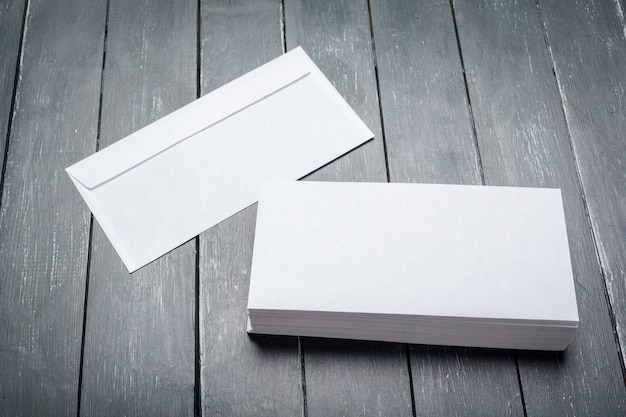 Photo of blank envelope on a  wooden surface 