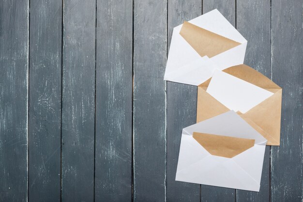 Photo of blank envelope on a  wooden 