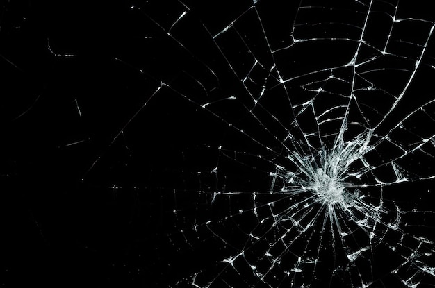 Photo photo of broken glass on a black background cracks