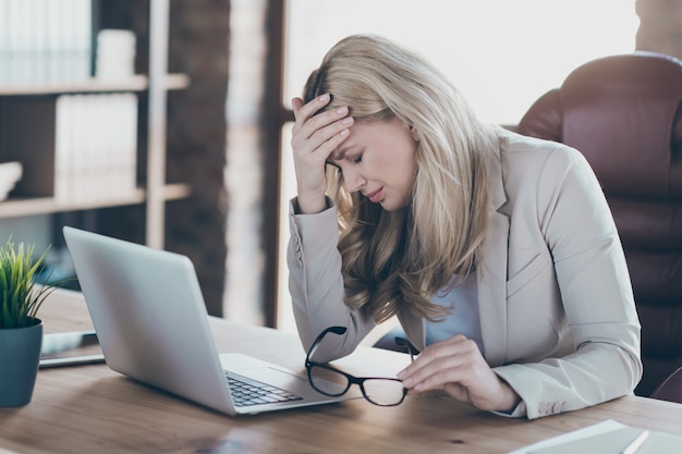 Photo of business lady holding head on hand tired feel dizzy