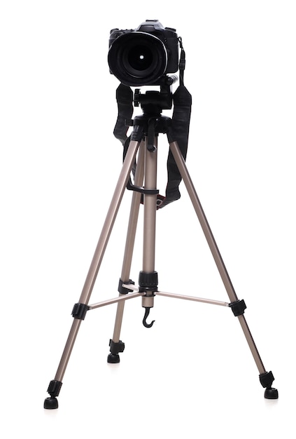 Photo camera on tripod isolated at white background