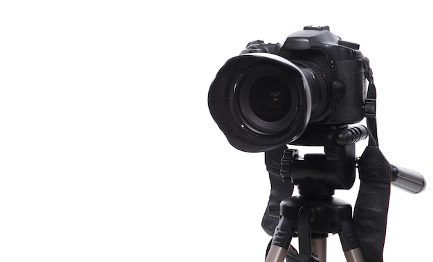 Photo camera on tripod isolated at white background