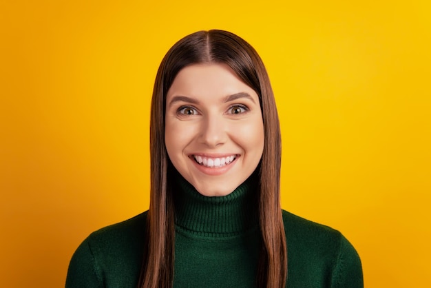 Photo of candid pretty charming lady look camera white smile wear green shirt isolated on yellow background