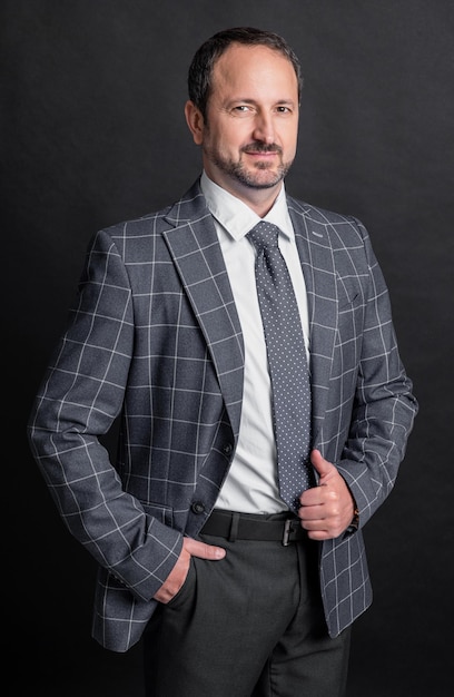 photo of caucasian business man in suit mature business man isolated on black background business man in studio business man wear jacket and tie