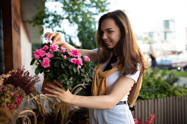 Photo of charming cute beautiful attractive brunette woman wearing stylish white tshirt and blue