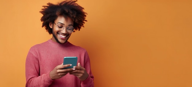 Photo of cheerful delighted African American man typing on the smartphone blue background with copy space