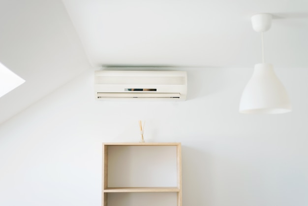 Photo of clean white room with air condition, summer days can be coolest.