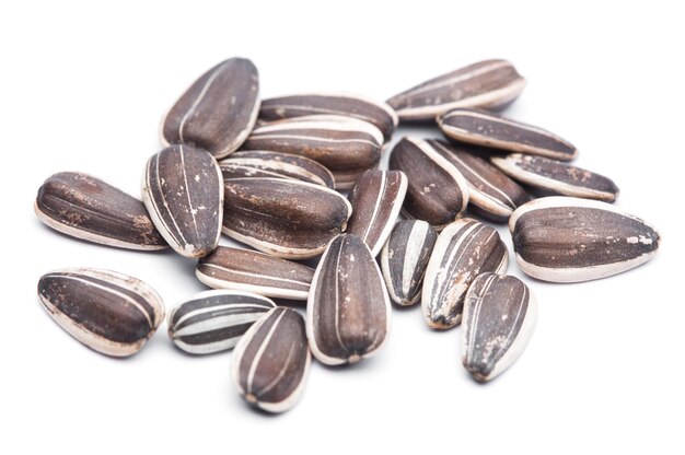 photo closeup of sunflower seeds on a white background