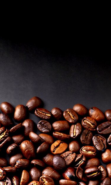 photo coffee beans full with copy space on dark surface background