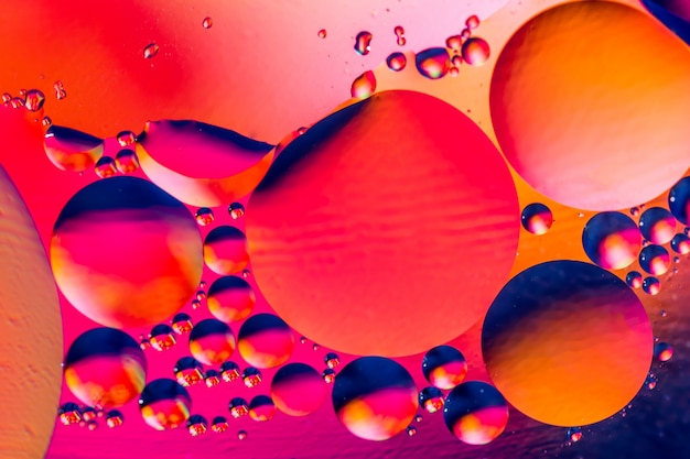 Photo of colorful bubbles of oxygen in water.