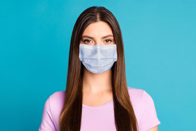 Photo of confident young lady wear blue face mask isolated blue color background