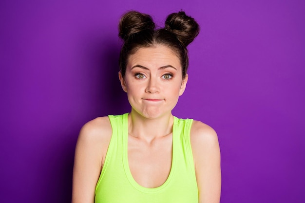 Photo of confused girl shrug shoulders isolated over vivid color background