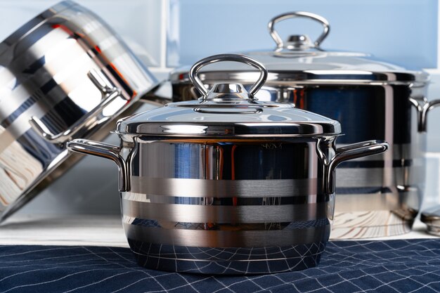  photo of cookware set on wooden kitchen counter