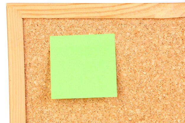 Photo of corkboard with a green post-it