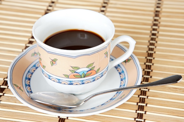 A photo of a Cup of coffee a over white background