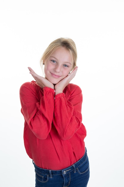 Photo of cute little girl in colored clothes on white background