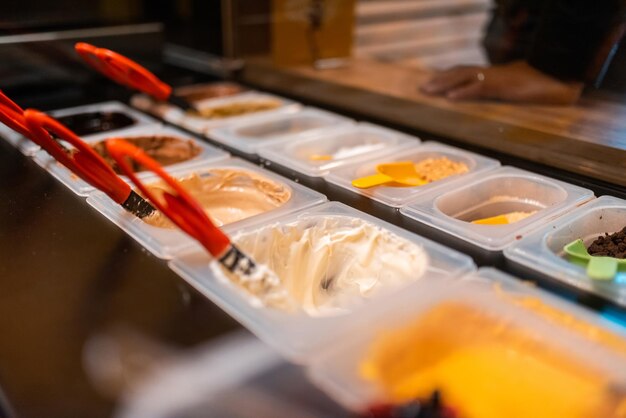 A photo of delicious cream chocolates in a modern patisserie Selective focus