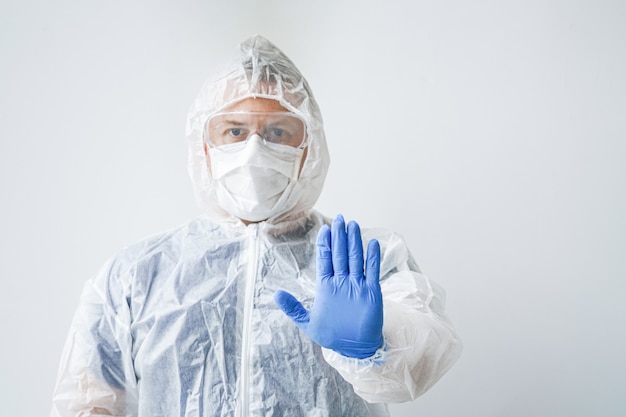 Photo of a doctor in a mask and overalls.