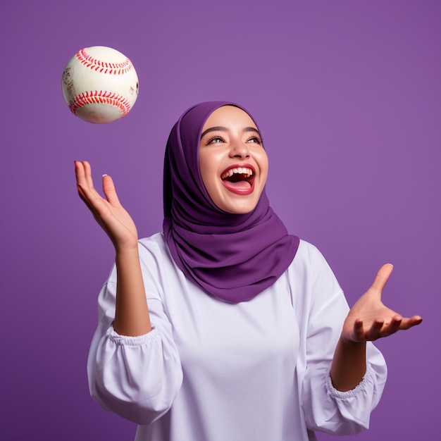 photo of excited hijab girl holding a ball