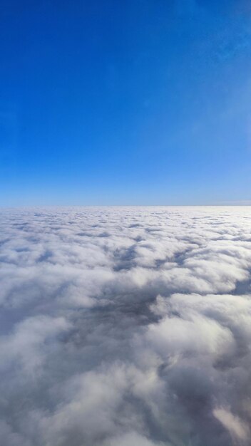 Photo of flying over white clouds