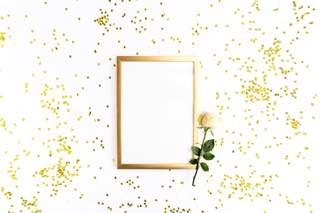 photo frame mock up with space for text golden confetti on white background lay flat top view