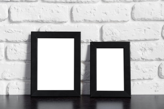 Photo frame with copy space against white brick wall