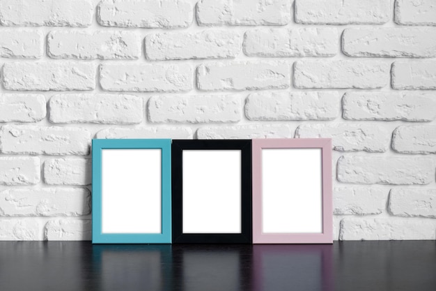 Photo photo frame with copy space against white brick wall