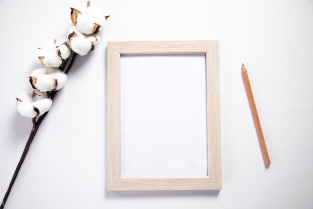 Photo frame with cotton flower and pencil