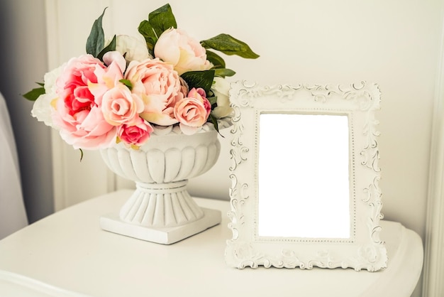 Photo photo frame with a white background in the interior of the bedroom