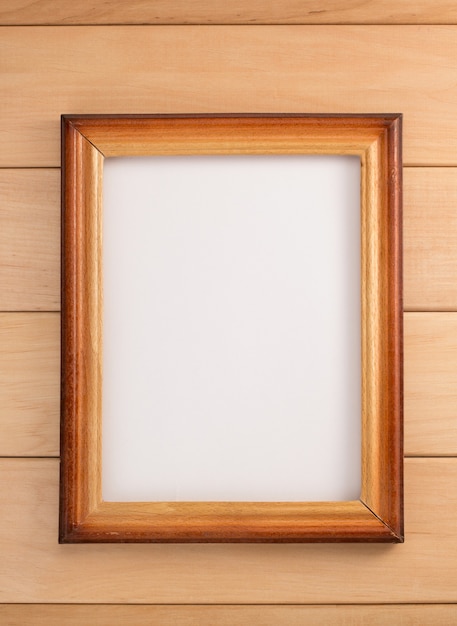 Photo frame on wooden background